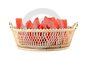 pieces watermelon in basket on a white background