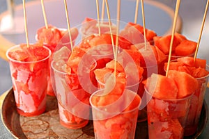 Pieces of watermelon in glasses on sale at the bar