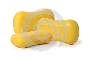 Pieces of yellow toilet soap on a white background. Full depth of field