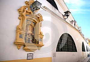 Piedad del Baratillo against wall, Seville, Spain