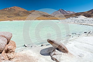 Piedras Rojas, volcano, snow, mountain, rocks, lake, white sand, turquoise water photo