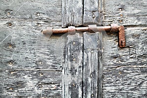 Pienza Val d'Orcia Tuscany Italy. Old wooden door with antique rusty door latch