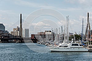 Pier 6 with sailboats at Charles River Harbor and Leonard P. Zakim Bunker Hill Memorial Bridge of Boston, USA