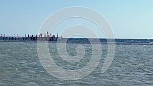 Pier Amidst Strong Currents: Red Sea Beauty in Egypt