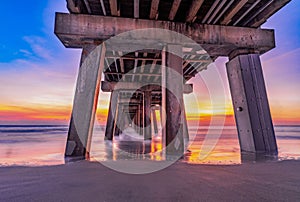 Pier on the beach in Fort Lauderdale, Florida at vivid sunset