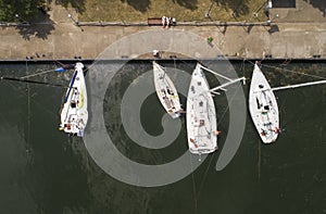 Pier with boats, marina lot. Aerial top view from drone