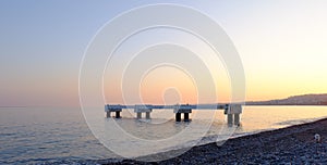 Pier in the calm sea, the city of Nice, France