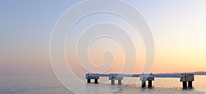 Pier in the calm sea, the city of Nice, France