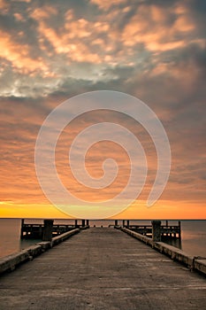 Pier and Cloudy Sunrise