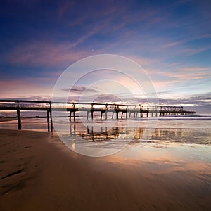 Pier at dawn with interesting reflections