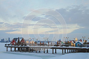 Pier on embankment in winter evening. Kazan, Russia