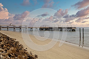 Pier and Empty Beach Beyond Seawall