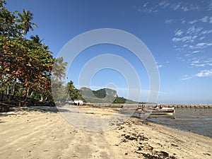 Pier en boats during low tide on Koh Mook island