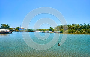 Pier and fishing boats in the lagoon