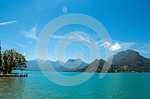 Pier with flowers on the lake of Annecy, in the village of Talloires.