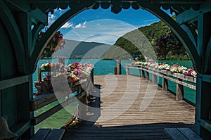 Pier with flowers on the lake of Annecy, in the village of Talloires.