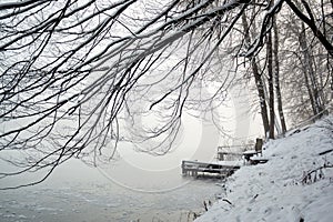 Pier on frozen winter lake