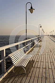 Pier in gdynia orlowo in poland after sunrise in wintertime, europe