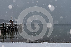 Pier on Herrenchiemsee with blowing snow