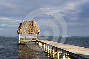 Pier and Hut at Sunset