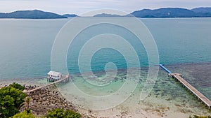 Pier with hut at the tropical beach at the island in Thailand. Koh Madsum.