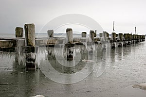 Pier with icicles at the baltic sea coast