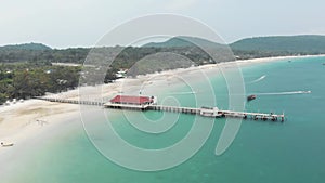 Pier with jetty. Clear turquoise water, white sand tropical beach, Koh Rong Samloem