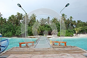 Pier at Kuda Bandos island Maldives