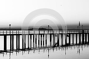 Pier on a lake with beautiful reflections