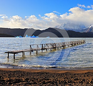 Pier on Lake Grey and blue iceberg