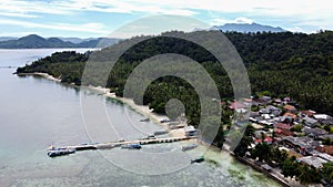 Pier with at Lampung Sea Pahawang Beach, located near the Sumatera city aerial drone. Resort Pahawang With a clouds on the Sky in