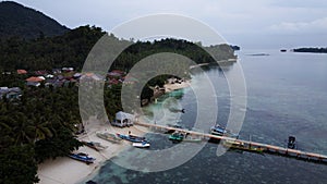 Pier with at Lampung Sea Pahawang Beach, located near the Sumatera city aerial drone. Resort Pahawang With a clouds on the Sky in