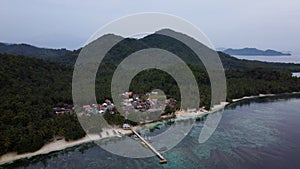 Pier with at Lampung Sea Pahawang Beach, located near the Sumatera city aerial drone. Resort Pahawang With a clouds on the Sky in