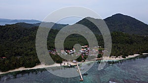 Pier with at Lampung Sea Pahawang Beach, located near the Sumatera city aerial drone. Resort Pahawang With a clouds on the Sky in