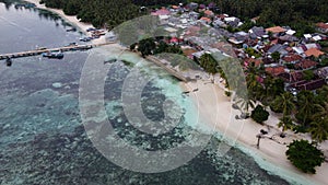 Pier with at Lampung Sea Pahawang Beach, located near the Sumatera city aerial drone. Resort Pahawang With a clouds on the Sky in