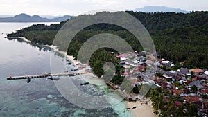 Pier with at Lampung Sea Pahawang Beach, located near the Sumatera city aerial drone. Resort Pahawang With a clouds on the Sky in