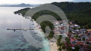 Pier with at Lampung Sea Pahawang Beach, located near the Sumatera city aerial drone. Resort Pahawang With a clouds on the Sky in