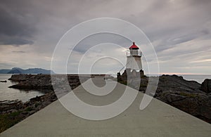 On the pier in Laukvik at sunset, Norway