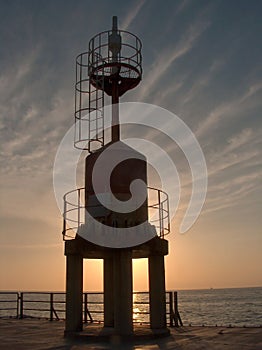 Pier light at sunset