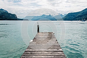 Pier in Mondsee lake a summer day