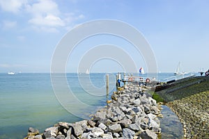 Pier near Marken lighthouse, sunny day