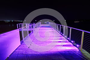 Pier at night, with purple lighting