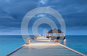 Pier into the ocean Raa Atoll Island Maldives