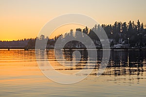 A pier over a lake on a winter sunset at Juanita Bay Park, Kirkland, Washington