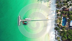 The pier of the paradise beach of Coconut Beach on the island of Koh Rong