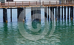 Pier Pillars into Green Sea