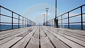 Pier planks with sea around