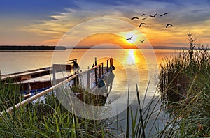 Pier reflected in water