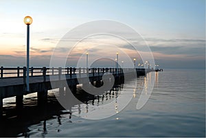 Pier on the river by night