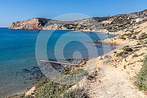Pier, Sand and cliffs in Agios Sostis Beach